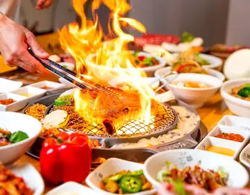 Flames rising from a grill